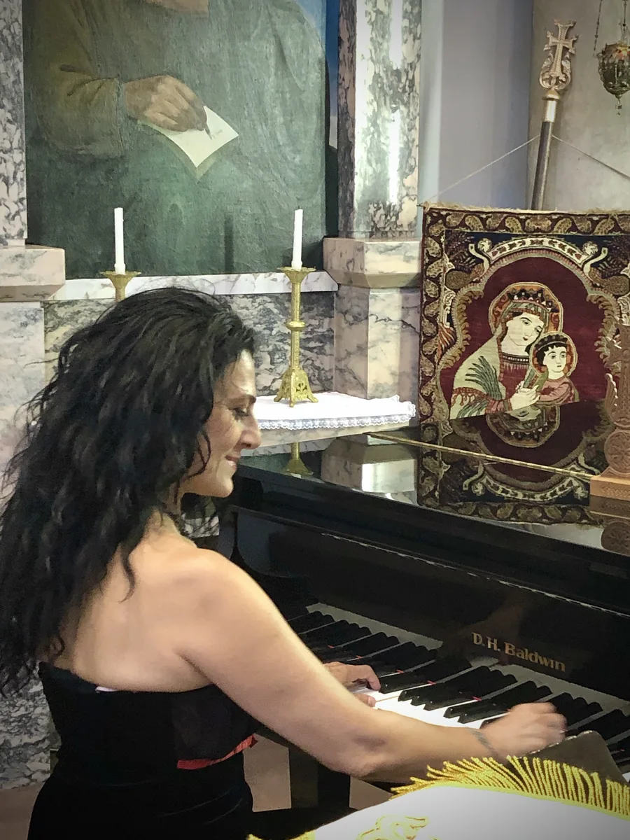 Anahit playing piano at an Armenian church