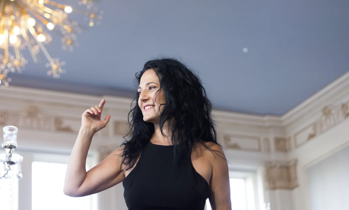 Anahit singing at an elegant venue